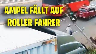 AMPEL FÄLLT AUF ROLLER FAHRER