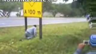 Man rides into sign