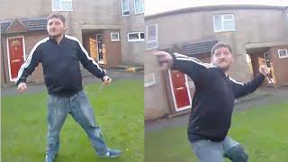 This is the terrifying moment man swings at police with huge knife