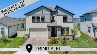 YOUR SLICE OF PARADISE IN TRINITY FLORIDA. ENJOY THIS WATERFRONT POOL HOME!