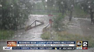 Neighbors in Owings Mills clean up after Monday's storm