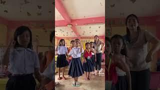 teacher & pupils dancing