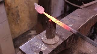 Forging a leaf from scrap steel