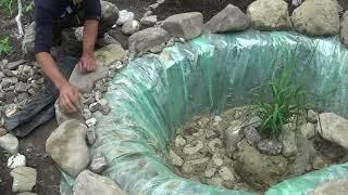 Waterfall and pond with fish in the garden (first part)