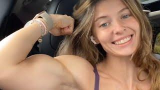 Beautiful muscle girl flexing big biceps