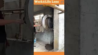Using a concrete cutting machine with a guide system for precise window expansion.