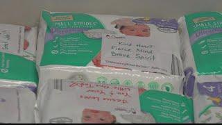 Refuge Church distributes free diapers, groceries