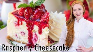 The BEST White Chocolate Raspberry Cheesecake - with raspberry sauce & whipped cream!