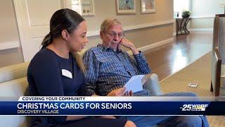 Students make Christmas cards for residents at senior living community