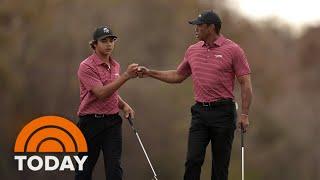 Charlie Woods celebrates with dad Tiger after his first hole-in-one