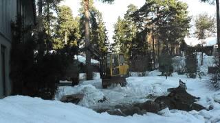 Mini excavator. Backfilling trench with the volvo.