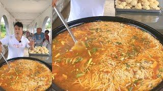 A Chinese Guy Cook Free Noodles / Lunch for the elders in a Downtown Village