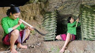 Poor girl began to build a new life, Making a shelter in a cave. Green forest life