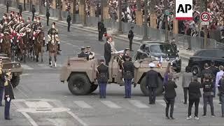 Macron arrives at Bastille Day parade, greets Modi