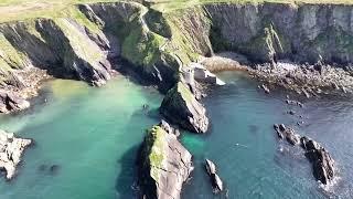 Dramatic cliffs and Dunquin winding Pier