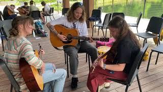 Billy Strings, Libby Lindblom, and Danielle Yother jamming at Blue Ridge Guitar Camp