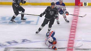 Andreas Englund drops Evander Kane in center ice, leading to both players squaring off.