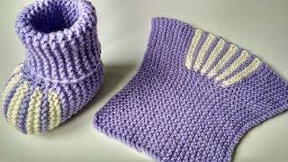 Knitted booties. Simple baby socks with knitting needles for newborns