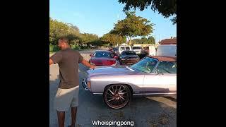 Convertible donk doing a burnout leaving a block party