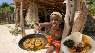 African village cooking/ Frying    Prawns  by the ocean.  