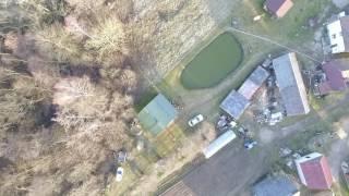 Vertical Landing Over Houses Near Forest - cutestockfootage.com