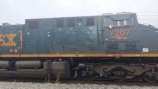 happy engineer blow his horn at family of railfans in Lowellville