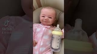 Lifelike Baby Doll Blinks and Smiles! 