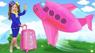 Anita plays with her dad and travels on a huge toy airplane