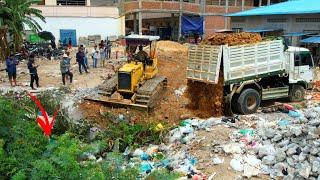 Starting New project Landfilling operator Bulldozer working push stone and Dump truck 5T unloading.