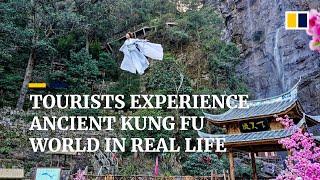 Dressed in costumes, tourists ‘fly’ into the sky to experience real life kung fu world