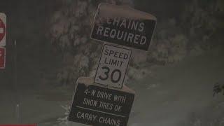 Drivers navigate through snowy conditions over the Sierra Nevada