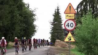 Szymon Godziek backflips the Tour de Pologne peloton on a road bike