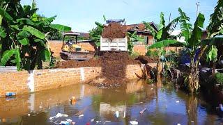 Beautiful Mini Dump Truck Unloading Dirt Into Pond site And Mitsubishi G Bulldozer Pushing Building