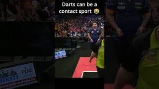 Darts players bumping into each other