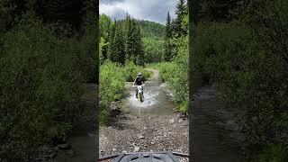 Dirt Biking Through a Stream on a Colorado Forest Service Road