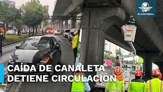 Cae canaleta del Segundo Piso de Periférico sobre dos automóviles