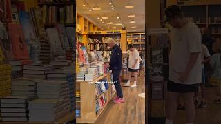 A lover of books with so many choices! Bill Clinton sifts through many books at a Hamptons bookstore