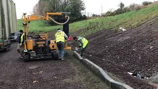 Site engineer setting out for kerbing gang