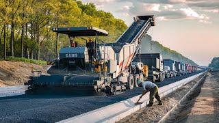 The equipment road building with paving machine operations gravel laying and compacting machinery