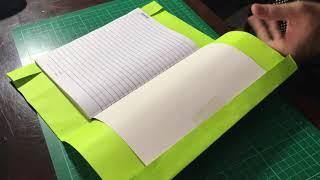 How to cover your notebook with a colored sheet of paper.