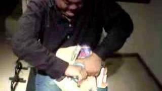Asian guy ripping phone book by Kenneth NG