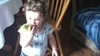 Baby’s face eating a bitter lemon