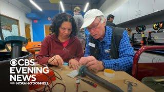 Volunteers in a California "fix it clinic" help neighbors salvage broken electronics