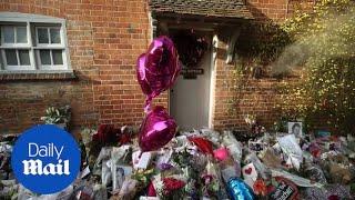 Floral tributes are left outside the home of George Michael - Daily Mail