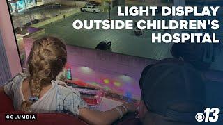 First responders create light display outside children's hospital