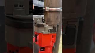 Roll grooving vertical pipe in a tight space.