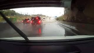 Water Splashes On Car's Windshield From Passerby's Vehicle While Driving On Highway - 1260885