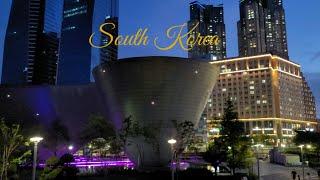 4k Songdo district of Incheon city. Neo-futuristic architecture of the Tri-Bowl. Songdo Central Park