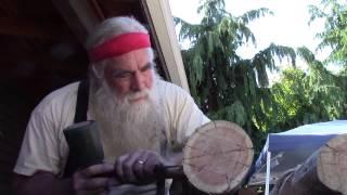 David Rogers demonstrates log craft Aug. 9, 2015, at Log House Museum