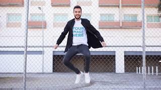 Nice Looking Guy Using T-Shirt Against a Fence Video Mockup